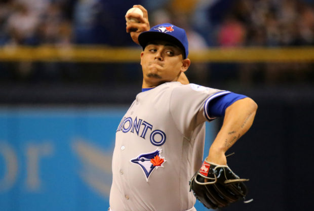 Blue Jays closer Roberto Osuna pitches in the ninth inning against the Rays.